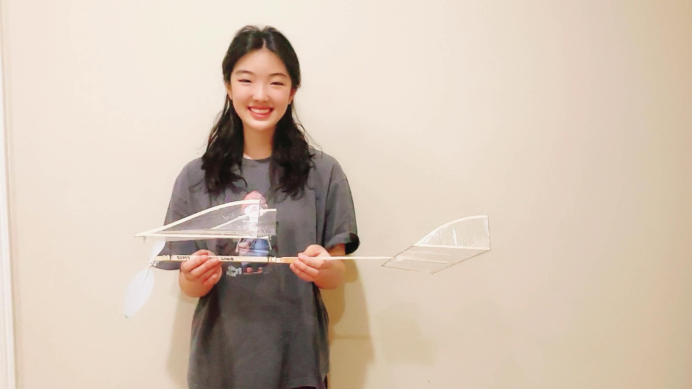 Amy Song holding a Science Olympiad glider